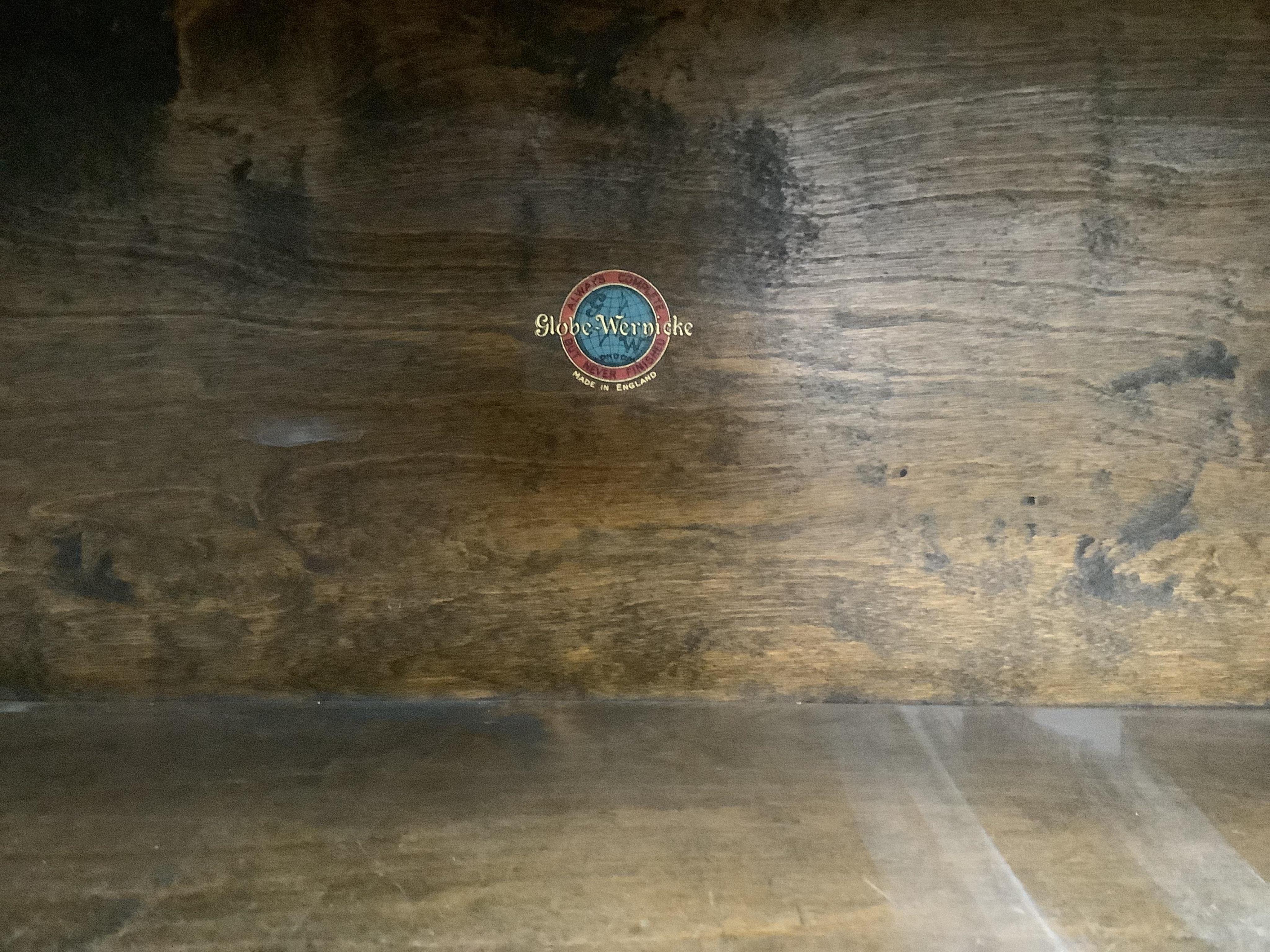A Globe Wernicke oak four section bookcase, width 86cm, depth 27cm, height 151cm. Condition - fair